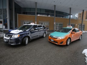 Cabs drivers outside the rear of Toronto General hospital on Friday, Feb. 4, 2022 say they have been mandated since November 2020 to be fully vaccinated.