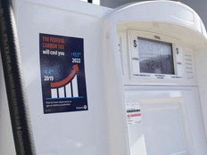 A gas pump displays an anti-carbon tax sticker in Toronto on Thursday, August 29, 2019.