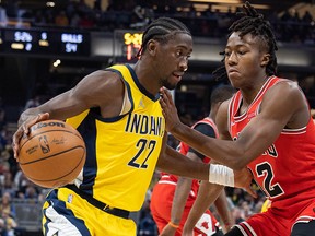 Indiana Pacers guard Caris LeVert (22) dribbles the ball while Chicago Bulls guard Ayo Dosunmu (12) defends at Gainbridge Fieldhouse.