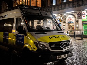 A police van parked outside Charing Cross Station.
