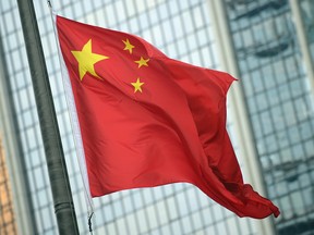 A Chinese flag flies at half mast in the Central district of Hong Kong on April 21, 2010.
