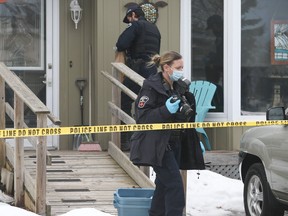 Durham Regional forensic officers bag up evidence and take images at a home located on Fairway Dr. in the Wilmot Creek gated community in Clarington. The body of a woman was found in a wooded area near Wixon Creek in Claremont opn Sunday night.