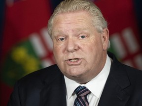 Ontario Premier Doug Ford holds a press conference at Queen’s Park regarding the easing of restrictions during the COVID-19 pandemic in Toronto on Thursday, January 20, 2022.