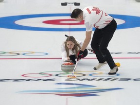 Canadian curlers Rachel Homan and John Morris practice at the Ice Cube Wednesday, February 2, 2022 at the 2022 Winter Olympics  in Beijing.