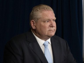 Ontario Premier Doug Ford attends a news conference at the Ontario legislature, in Toronto, on Monday, February 14, 2022.