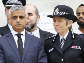 In this file photo taken on June 19, 2018 London Mayor Sadiq Khan (left) and Metropolitan Police Commissioner Cressida Dick stand on the steps of Islington Town Hall with community and police leaders on the anniversary of the Finsbury park attack in London
