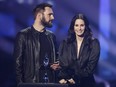 Johnny McDaid and Courteney Cox present during the Brit Awards at the O2 Arena in London, England, Feb. 8, 2022.