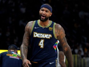 Denver Nuggets centre DeMarcus Cousins reacts during the second quarter against the Brooklyn Nets at Ball Arena in Denver, Feb. 6, 2022.