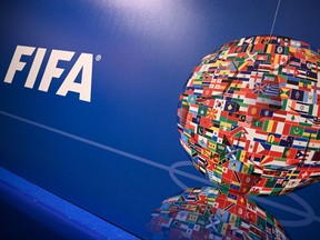 This file photo taken on Feb. 15, 2019 shows the FIFA logo during a press conference held by the president of the soccer governing body at the FIFA Executive Football Summit in Istanbul.