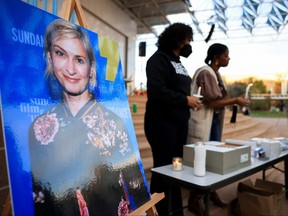 An image of cinematographer Halyna Hutchins, who died after being shot by Alec Baldwin on the set of his movie "Rust", is displayed at a vigil in her honour in Albuquerque, New Mexico, Oct. 23, 2021.