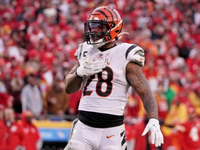 Cincinnati Bengals running back Joe Mixon (28) reacts after a play against the Kansas City Chiefs during overtime of the AFC Championship Game at GEHA Field at Arrowhead Stadium Jan. 30, 2022.