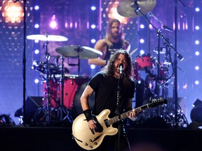 Dave Grohl and Taylor Hawkins of the Foo Fighters perform after the band was inducted into the Rock and Roll Hall of Fame, in Cleveland, Ohio, Oct. 30, 2021.