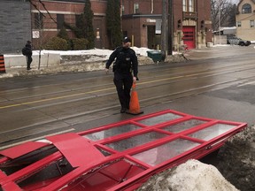 Toronto Police at the scene at Toronto Fire Station 227 at Woodbine Ave. and Queen St. E.  after a woman gained access to the truck and smashed through the front door on Thursday, February 10, 2022.