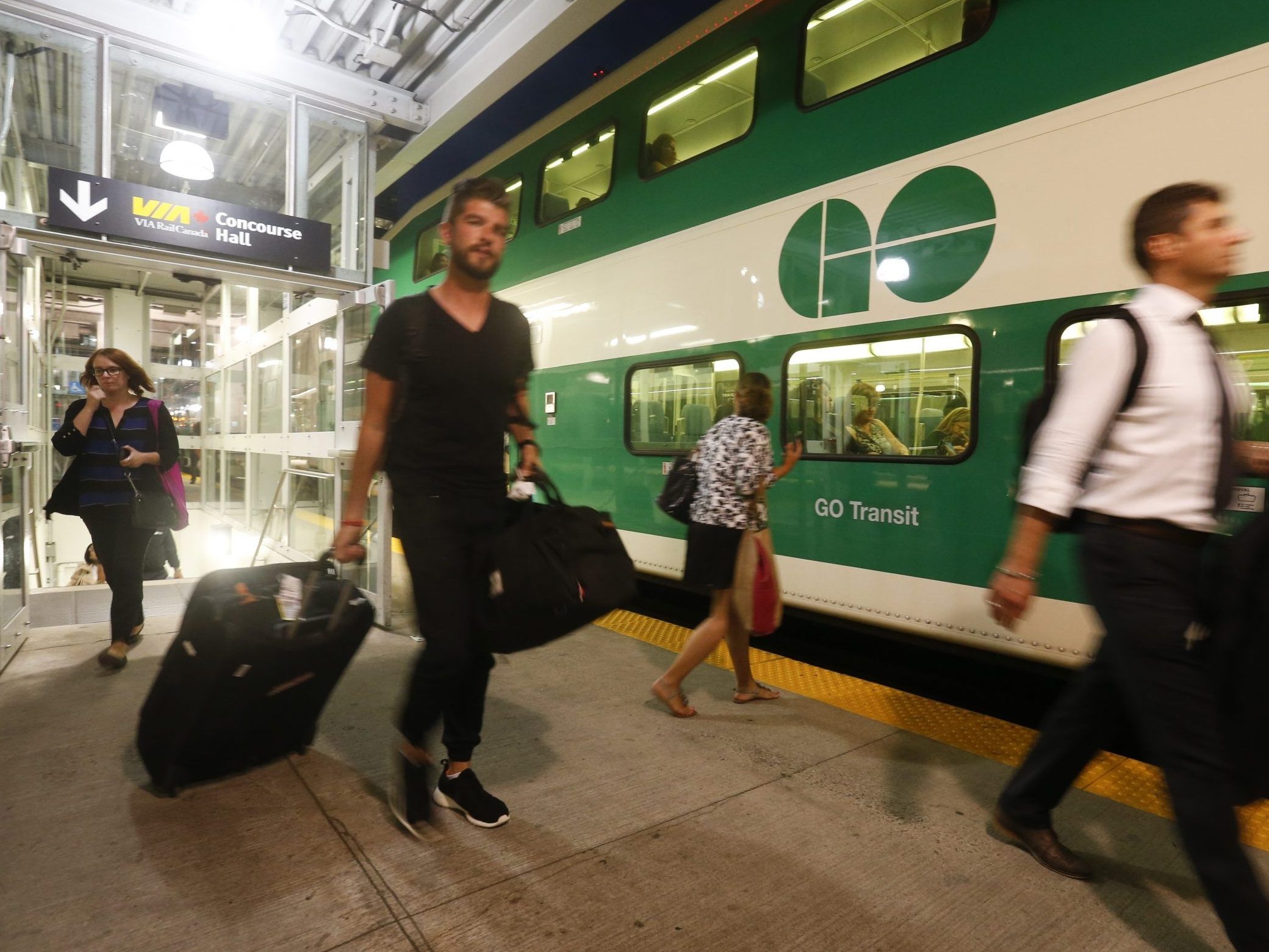 GO Train commuters board an eastbound train at Union Station on  Thursday, Sept. 10, 2015. 