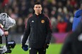 Manchester United's Portuguese striker Cristiano Ronaldo gestures before taking his place on the substitute's bench before the English Premier League football match between Burnley and Manchester United at Turf Moor in Burnley, north west England on February 8, 2022. - (Photo by PAUL ELLIS/AFP via Getty Images)