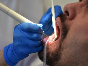 This file photo shows a patient at a dental clinic.