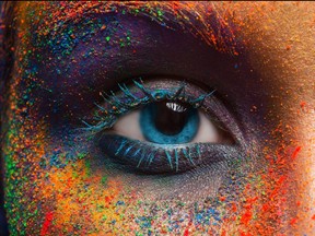 Eye of model with colorful art make-up, close-up