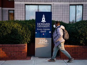 A student walks on the campus of Howard University, one of six historically Black colleges and universities (HBCUs) across the United States that received bomb threats, in Washington, January 31, 2022.