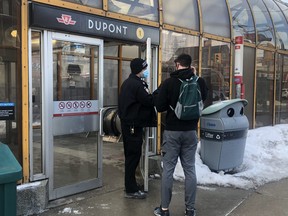 A Toronto Police officer at Dupont Station after an employee was stabbed in the back on Wednesday, Feb. 9, 2022.