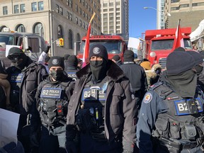 Toronto Police maintain order during the truckers protest in downtown Toronto on Saturday, Feb. 5, 2022.