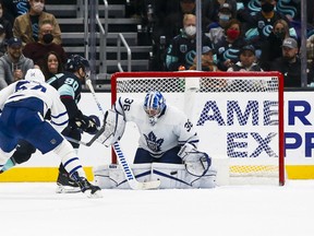 Maple Leafs goaltender Jack Campbell (36) makes a save on Seattle Kraken winger Marcus Johansson (90) during the second period at Climate Pledge Arena.