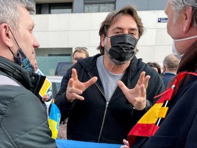 Spanish actor Javier Bardem and Ukrainians attend a protest in front of the Russian Embassy, after Russian President Vladimir Putin authorized a military operation in eastern Ukraine, in Madrid, Spain, Feb. 24, 2022.
