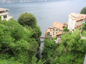 The mummified body of a 70-year-old Italian woman was found sitting at her dining room table, near Lake Como according to reports.