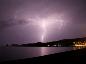 Lightning strikes are seen above Villarrica lake, in Villarrica, Chile, December 7, 2021.