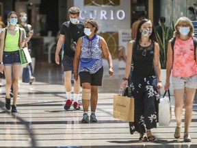 Shoppers wearing masks at CF Sherway Gardens in Toronto, Ont. on Tuesday July 7, 2020.  This is the first day of the mandatory masks or face covering bylaw. Ernest Doroszuk/Toronto Sun/Postmedia