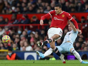 Manchester United's Mason Greenwood is seen in action against West Ham United's Aaron Cresswell Jan. 22, 2022 at Old Trafford.