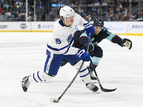 Toronto Maple Leafs winger Mitch Marner fires the puck against the Seattle Kraken on Monday night at Climate Pledge Arena.