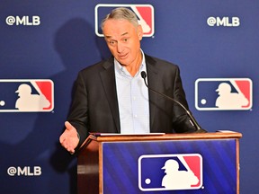 Major League Baseball Commissioner Rob Manfred answers questions during an MLB owners meeting at the Waldorf Astoria on February 10, 2022 in Orlando, Florida.