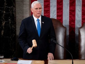 U.S. Vice President Mike Pence officiates as a joint session of the House and Senate convenes to confirm the Electoral College votes cast in the 2020 election, at the Capitol in Washington, D.C., Jan. 6, 2021.