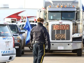 Protesters set up a roadblock on Highway 4 outside of Milk River heading towards the Coutts border crossing on Tuesday, Feb. 8, 2022.