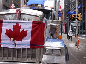 A truck participates in a blockade of downtown streets near the Parliament building as a demonstration led by truck driver continues in Ottawa, Wednesday, Feb. 16, 2022.