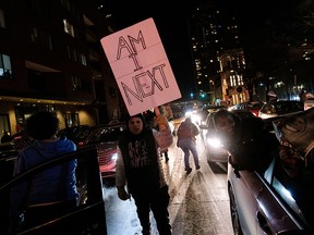 Demonstrators take part in a protest for Amir Locke, a Black man who was shot and killed by Minneapolis police’s SWAT team, at a protest in Minneapolis, Minnesota, February 4, 2022.