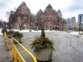 Heavy planters are seen along the perimeter of Queen’s Park in Toronto on Wednesday, Feb. 2, 2022. The planters were placed to serve as potential barriers ahead of a potential truckers' rally.