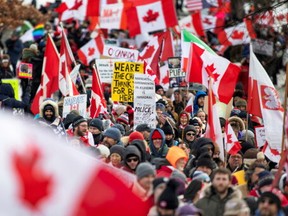 Protestors gather at Queen’s Park as truckers and their supporters continue to protest COVID-19 vaccine mandates and restrictions in Toronto, Ontario, Canada, on Saturday, Feb. 12, 2022.