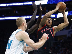 Scottie Barnes (right) was about the only Raptor who had it going during a blowout loss against Charlotte on Friday.