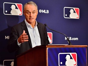 Major League Baseball Commissioner Rob Manfred answers questions during an MLB owner's meeting at the Waldorf Astoria on February 10, 2022 in Orlando, Florida.