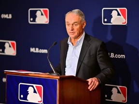 MLB Commissioner Rob Manfred answers questions during an owner's meeting at the Waldorf Astoria in Orlando, Fla., Feb. 10, 2022.