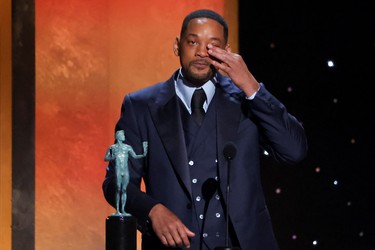 Will Smith receives the award for Outstanding Performance by a Male Actor in a Leading Role for "King Richard" at the 28th Screen Actors Guild Awards, in Santa Monica, Calif., Sunday, Feb. 27, 2022.