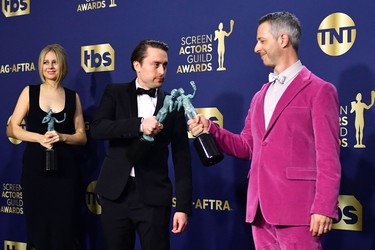 U.S. actors Kieran Culkin (C) and Jeremy Strong (R) pose with the award for Outstanding Performance by an Ensemble in a Drama Series Succession in the press room during the 28th Annual Screen Actors Guild Awards at the Barker Hangar in Santa Monica, Calif., Sunday, Feb. 27, 2022.