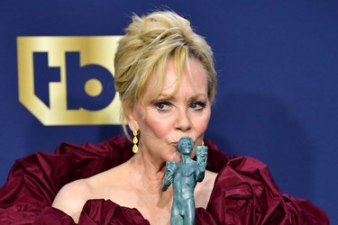 US actress Jean Smart poses with the award for Outstanding Performance by a Female Actor in a Comedy Series for Hacks in the press room during the 28th Annual Screen Actors Guild Awards at the Barker Hangar in Santa Monica, Calif., Sunday, Feb. 27, 2022.