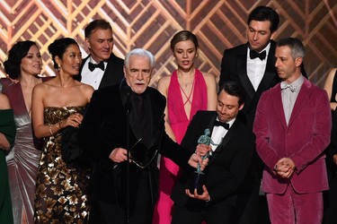 Scottish actor Bryan Cox (C) and members of the cast from Succession accept the award for Outstanding Performance by an Ensemble in a Drama Series onstage during the 28th Annual Screen Actors Guild Awards at the Barker Hangar in Santa Monica, Calif., Sunday, Feb. 27, 2022.