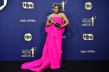 U.S. actress Ariana DeBose poses with her award for Outstanding Performance by a Female Actor in a Supporting Role for West Side Story in the press room during the 28th Annual Screen Actors Guild Awards at the Barker Hangar in Santa Monica, Calif., Sunday, Feb. 27, 2022.