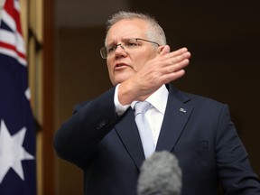 This file photo taken on January 6, 2022 shows Australia's Prime Minister Scott Morrison speaking to the media during a press conference at Parliament House in Canberra.