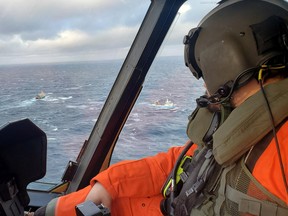 Search vessels are seen from a plane after a Spanish fishing trawler sank off the Canadian coast on Tuesday,  February 15, 2022 in this picture obtained from social media.