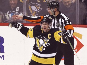Pittsburgh Penguins centre Sidney Crosby (87) reacts after scoring his 500th career NHL goal against the Philadelphia Flyers at PPG Paints Arena.