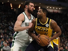 Tristan Thompson of the Indiana Pacers is defended by Sandro Mamukelashvili of the Milwaukee Bucks at Fiserv Forum on February 15, 2022 in Milwaukee, Wisconsin.
